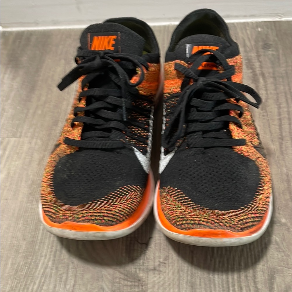 Nike Free Black and Orange Athletic Shoes with Breathable Mesh